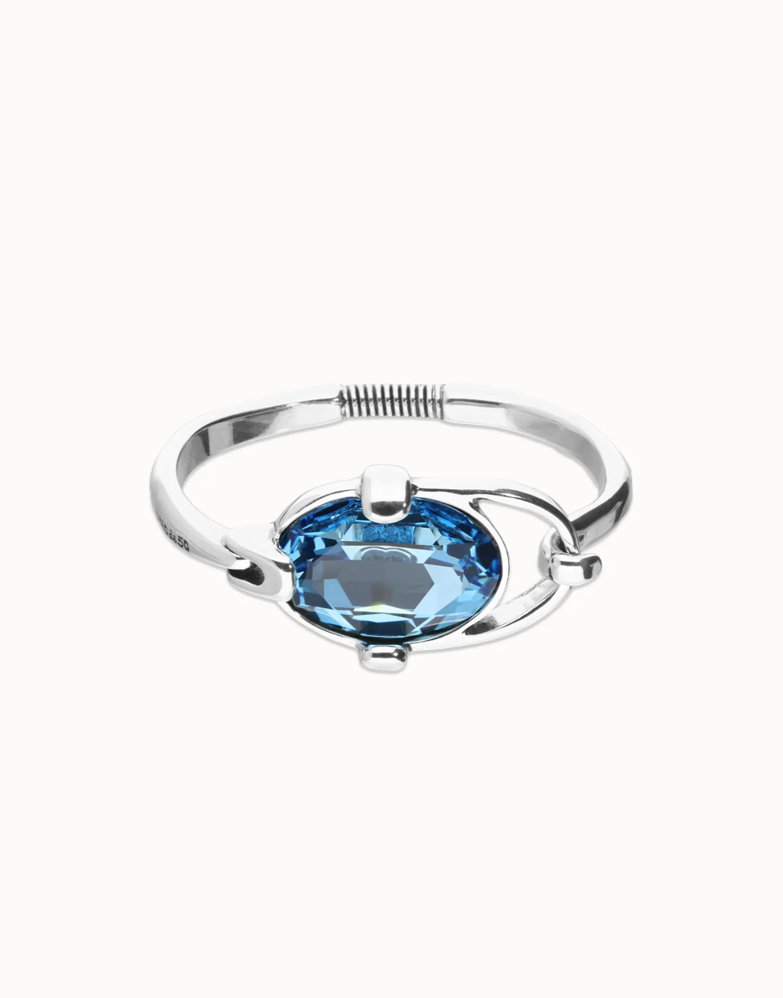 Bangle bracelet with faceted blue crystal
