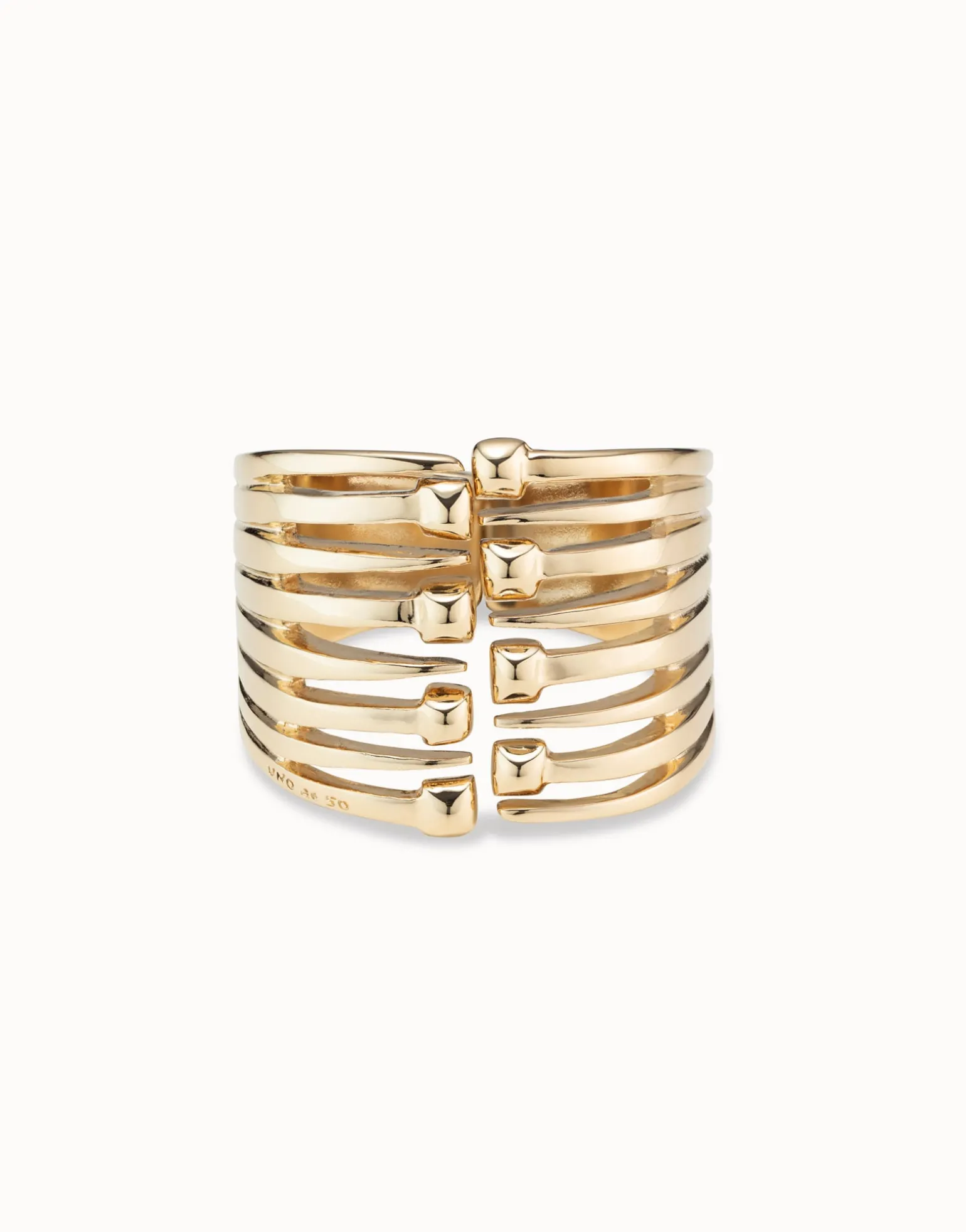 Bangle bracelet with multiple nail heads