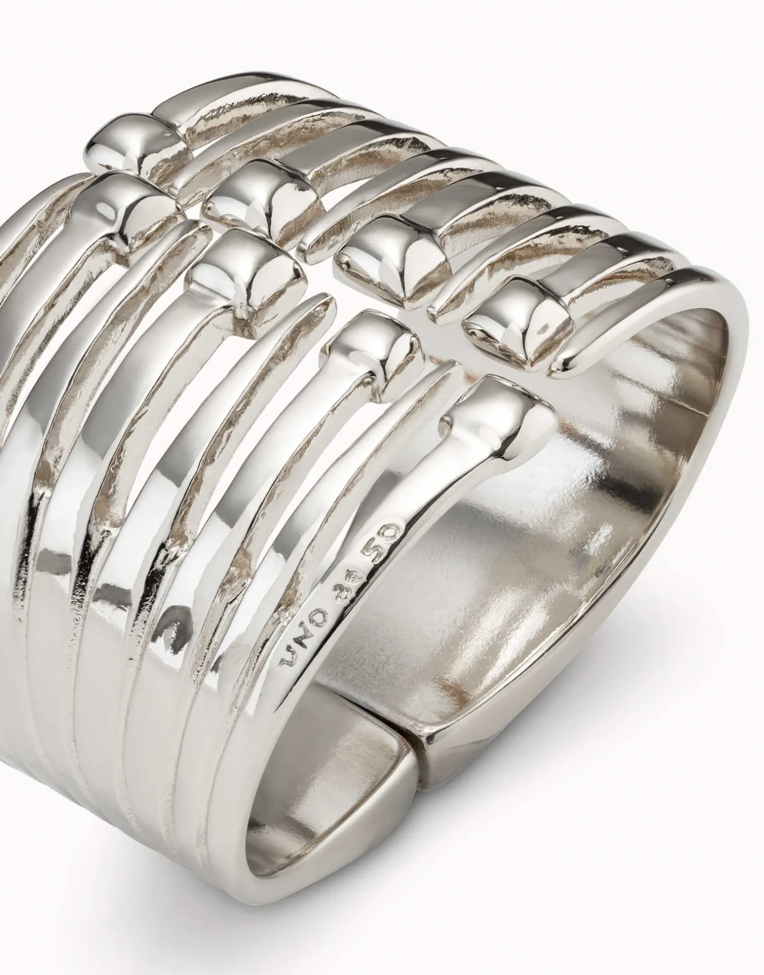 Bangle bracelet with multiple nail heads