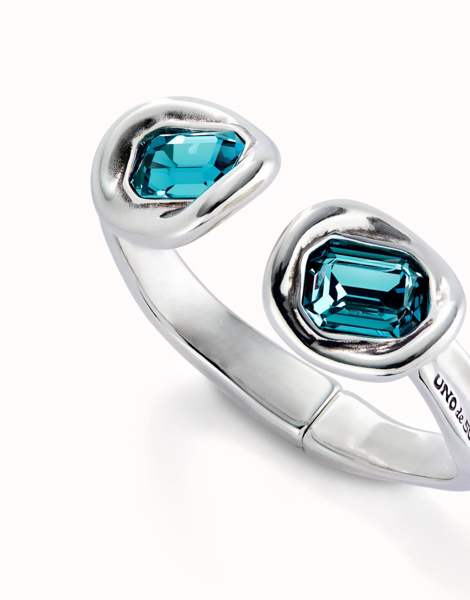 Bangle bracelet with two sky-blue crystals