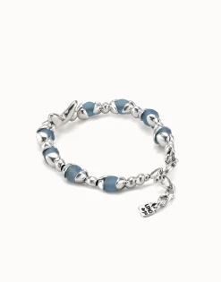 Beaded bracelet with blue crystals and a central butterfly