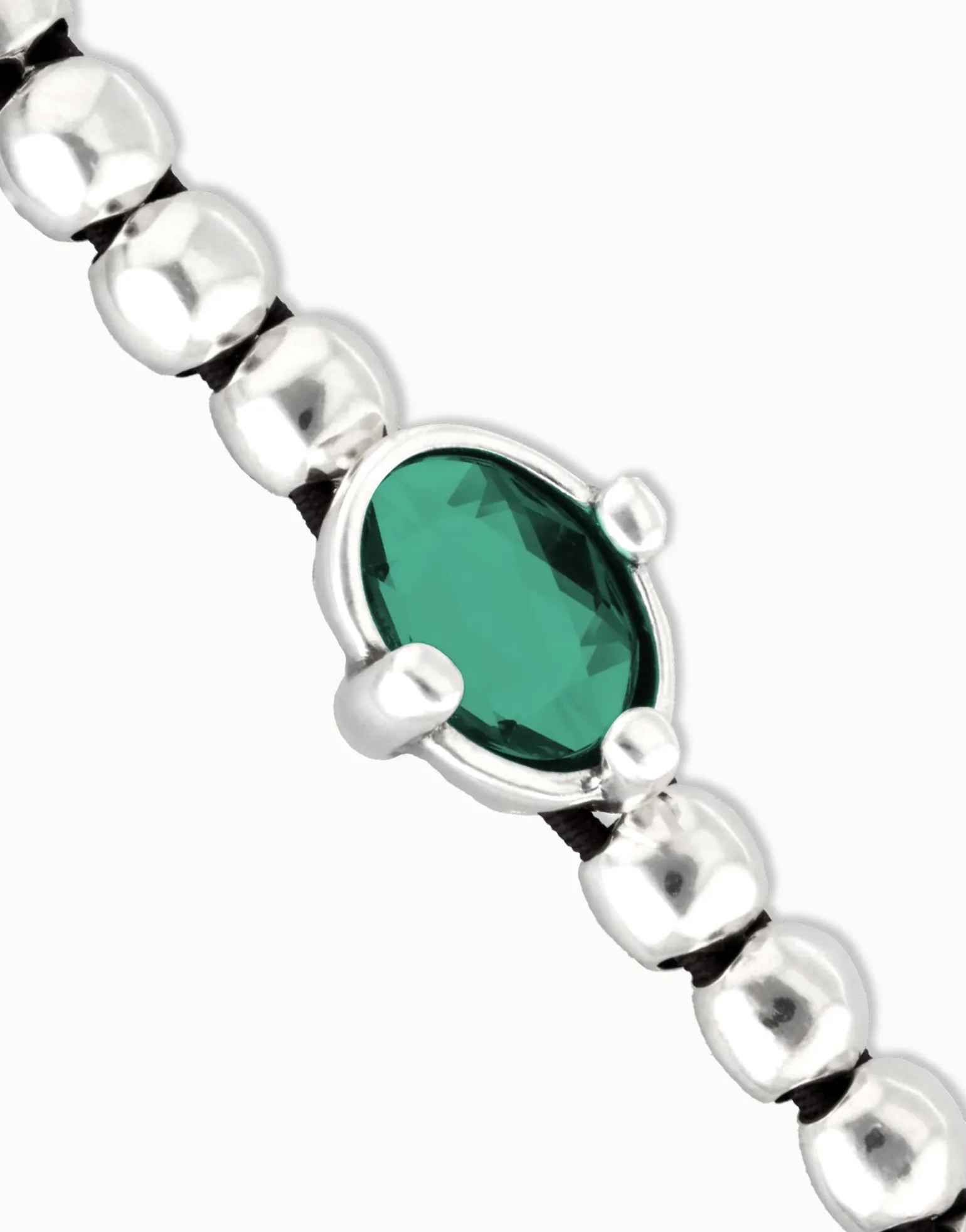 Beaded bracelet with oval faceted green crystal