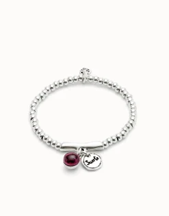 Beaded stretch bracelet with a murano glass and the word lucky