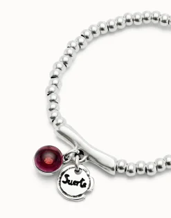 Beaded stretch bracelet with a murano glass and the word lucky