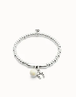 Beaded stretch bracelet with a murano glass and a horseshoe charm