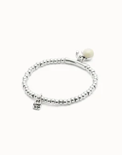 Beaded stretch bracelet with a murano glass and a horseshoe charm