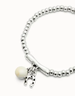 Beaded stretch bracelet with a murano glass and a horseshoe charm