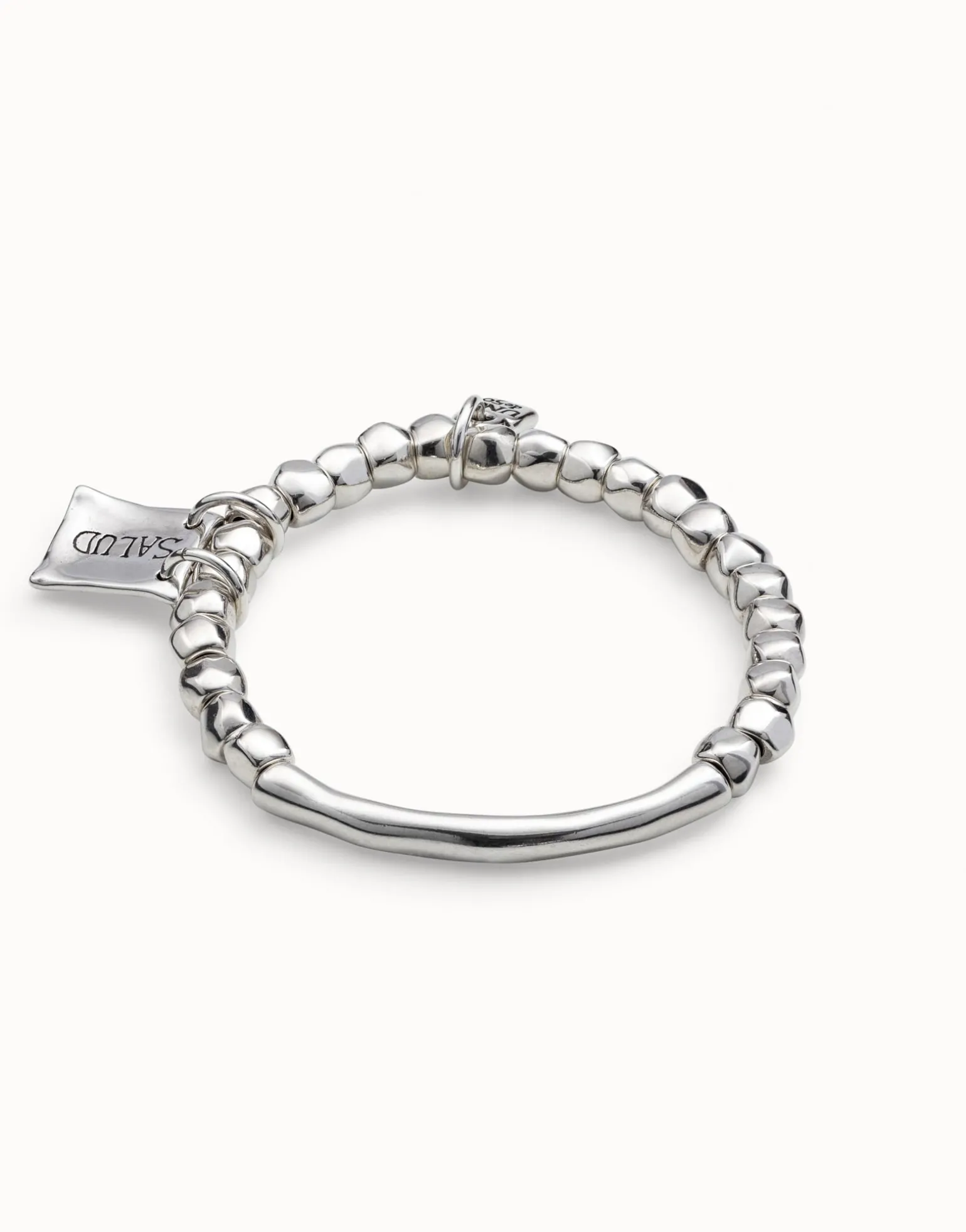 Beaded stretch bracelet with tubular piece and charms