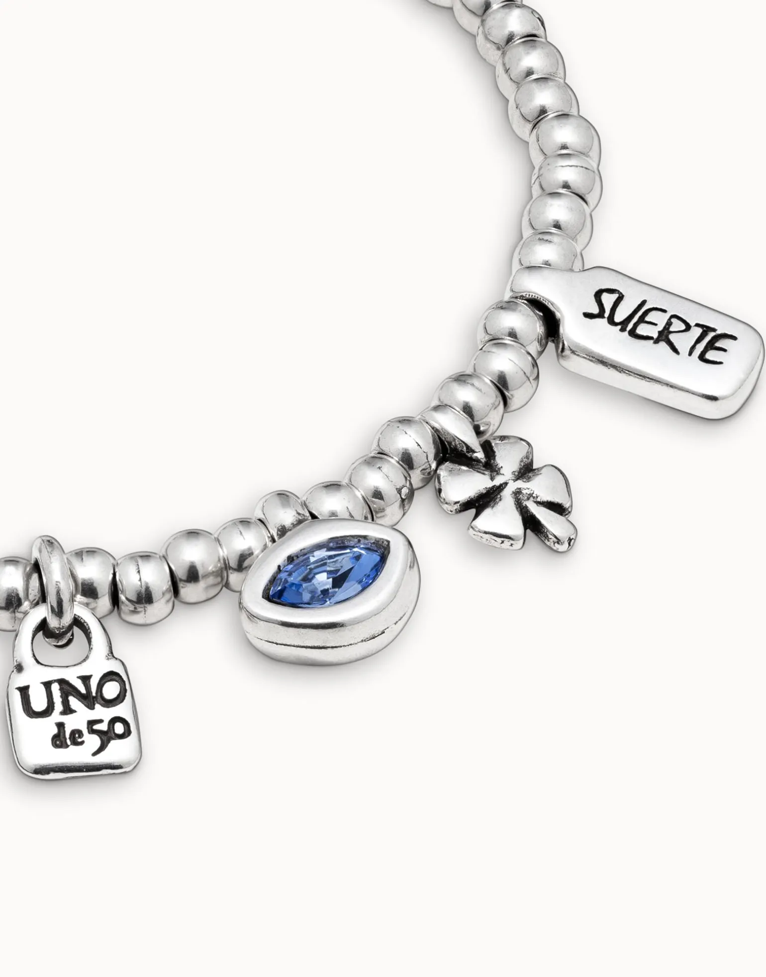 Beaded stretch bracelet with charms