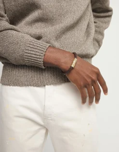 Brown braided leather bracelet with a metal detail