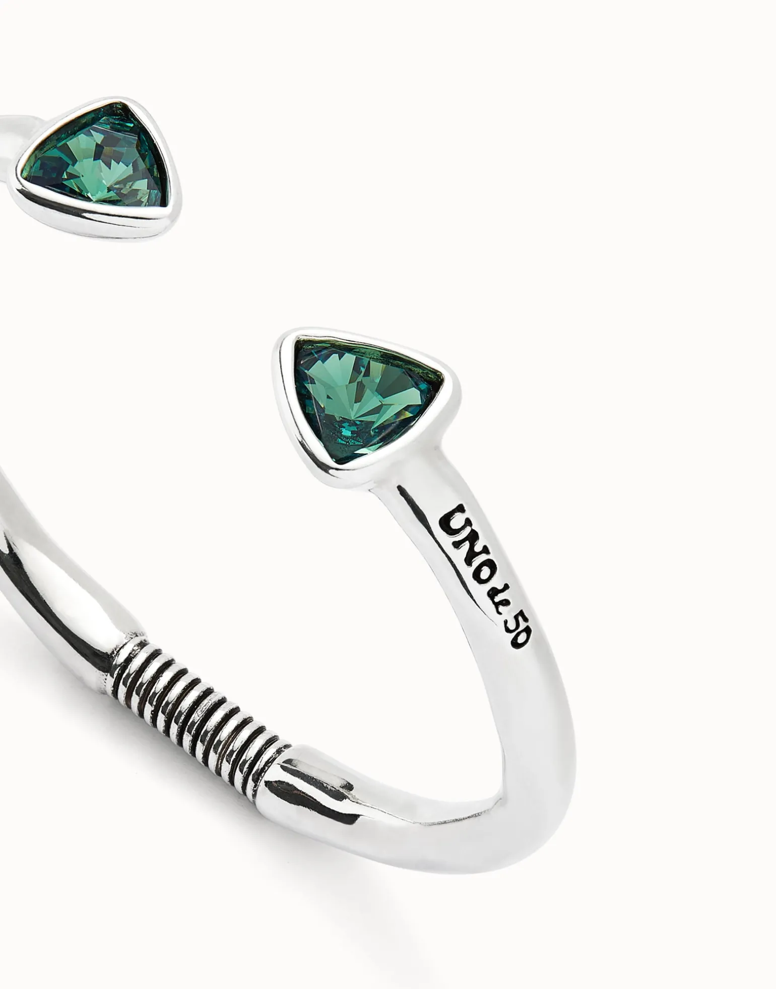 Cuff bracelet with two green crystals