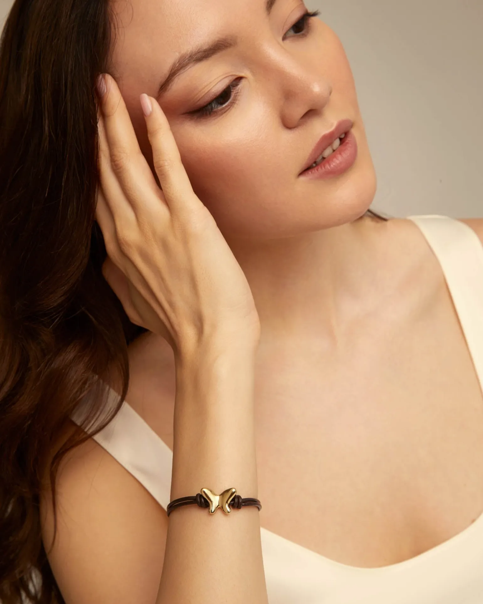 Double strand leather bracelet with a butterfly
