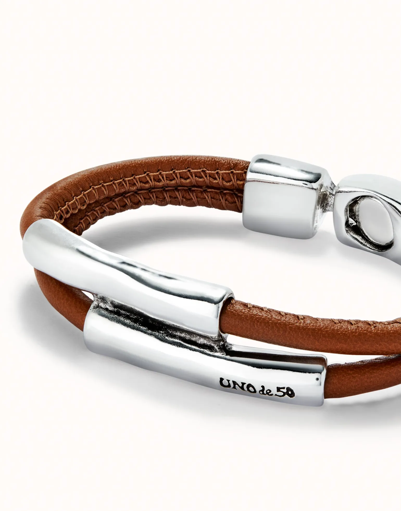 Double strand lether bracelet with two tubes