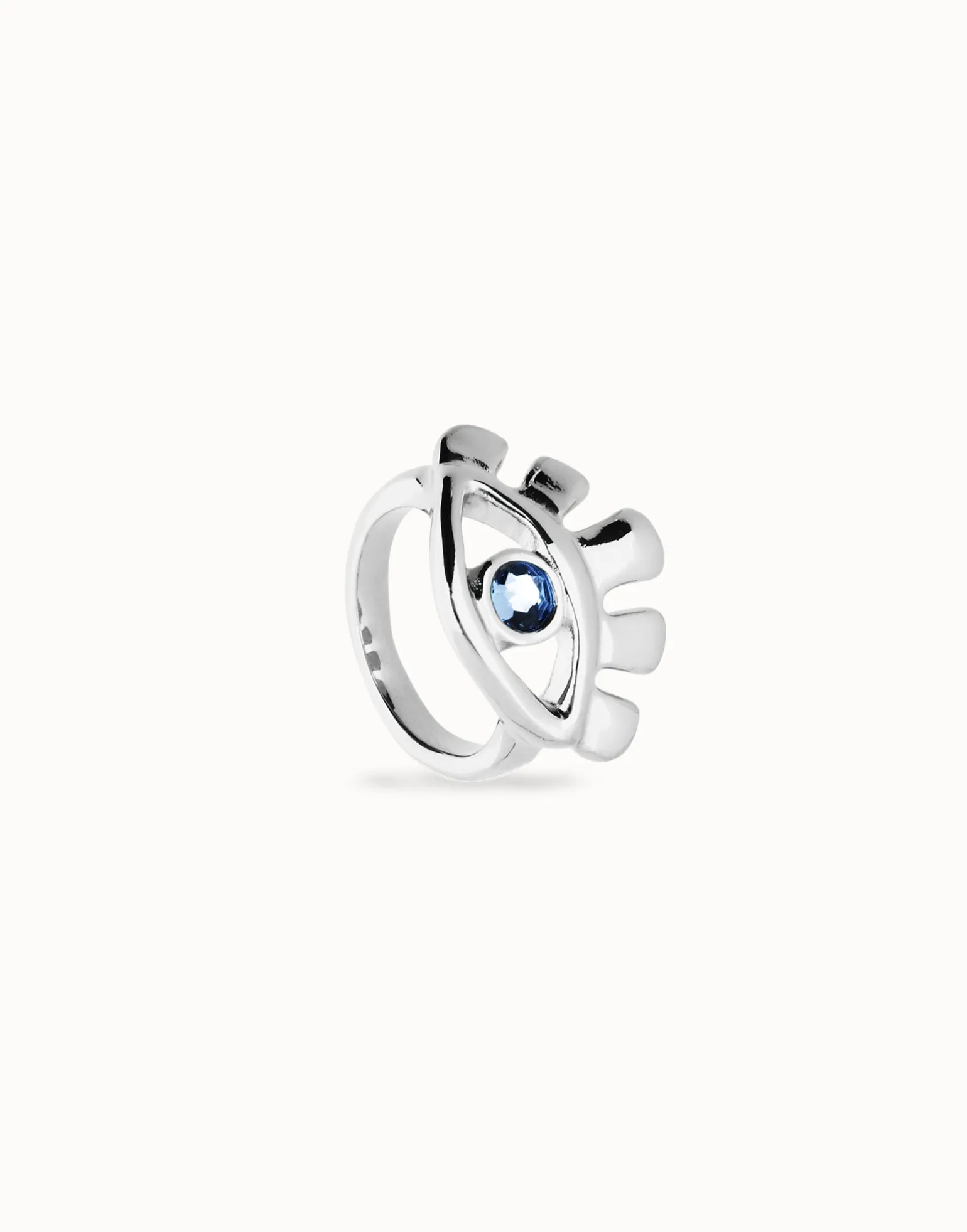 Eye-shaped ring with faceted blue crystal