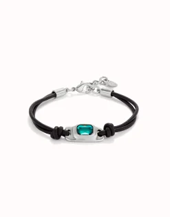 Leather bracelet with a green crystal