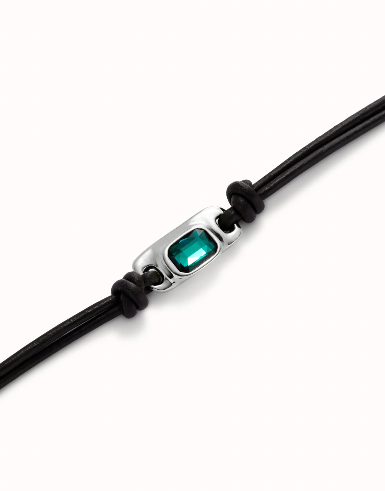 Leather bracelet with a green crystal