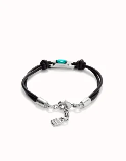 Leather bracelet with a green crystal