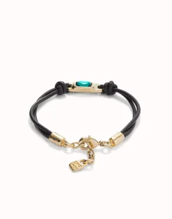 Leather bracelet with a green crystal