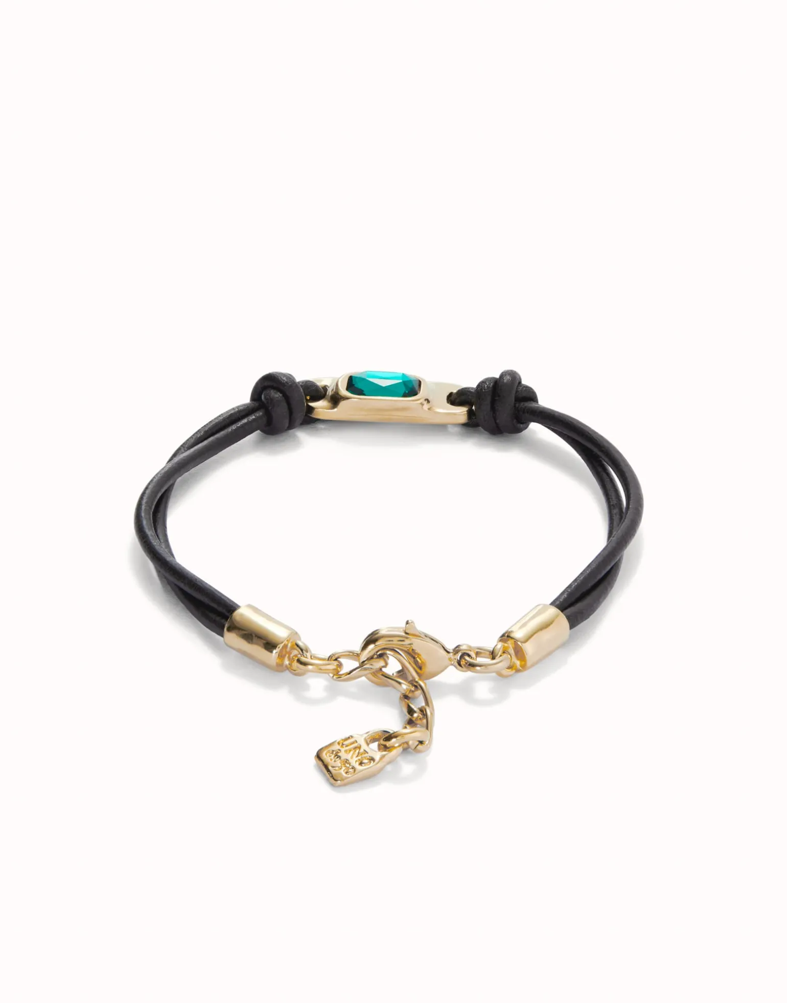 Leather bracelet with a green crystal