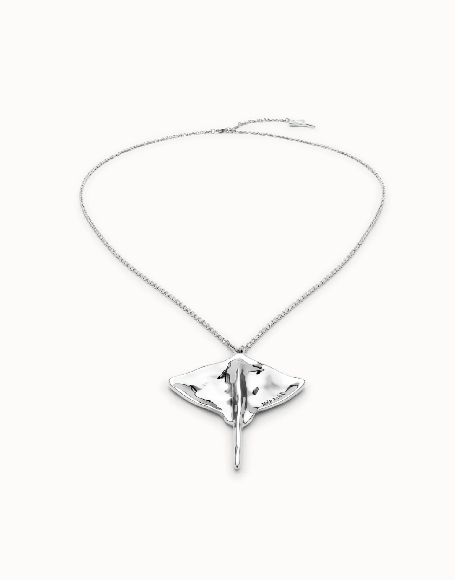 Long chain pendant necklace with manta ray