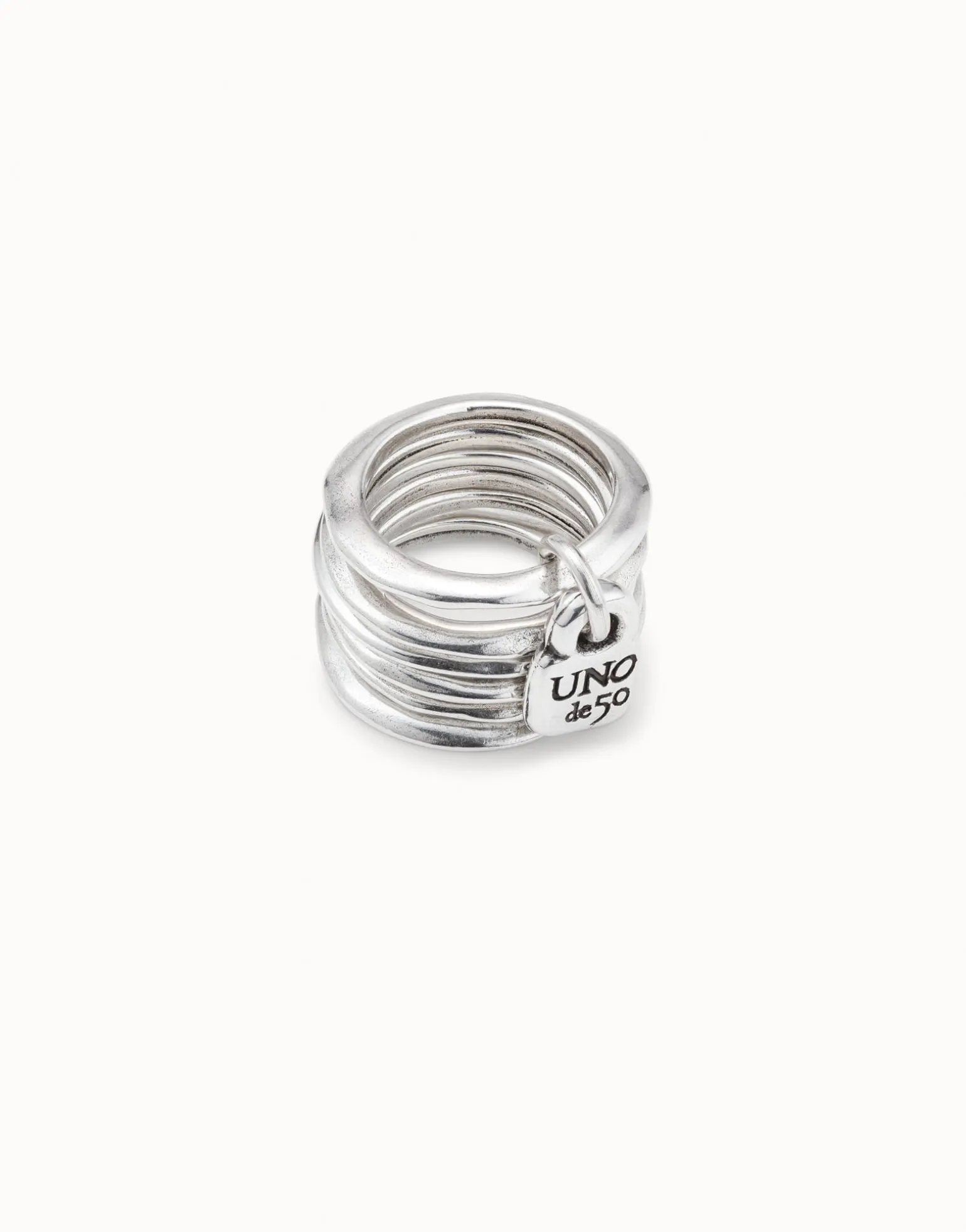 Multi row ring with a charm
