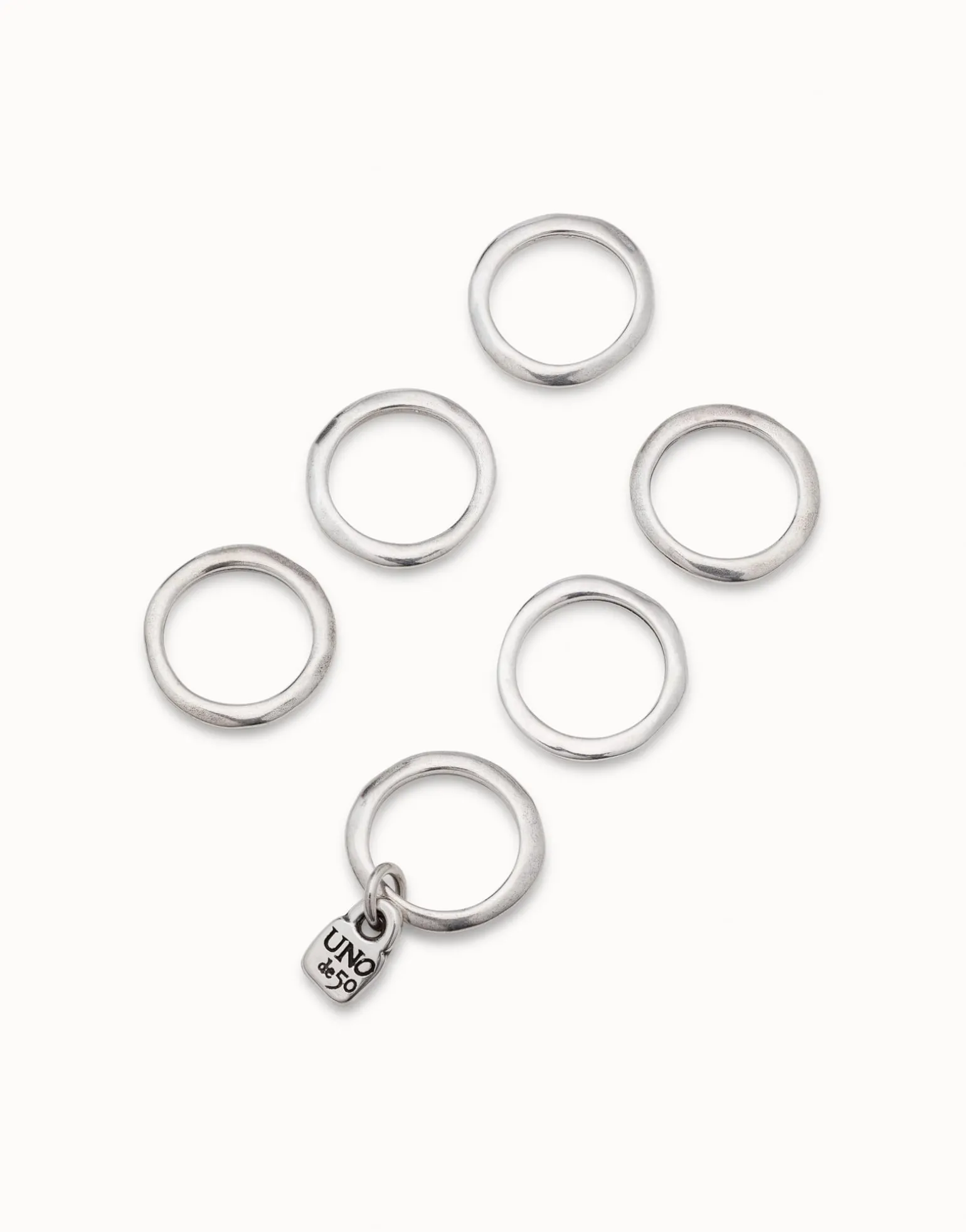 Multi row ring with a charm