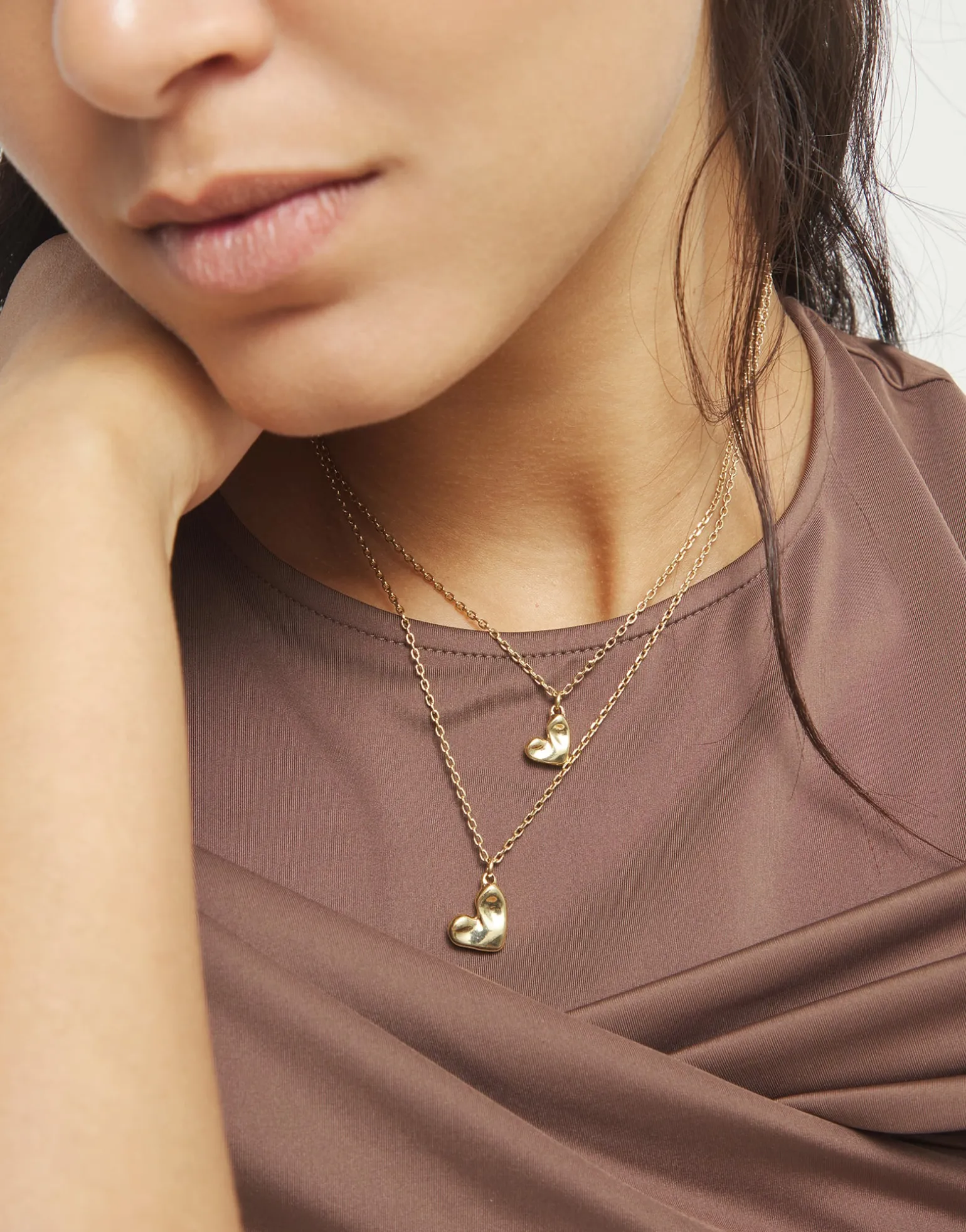 Multi strand chain necklace with two hearts