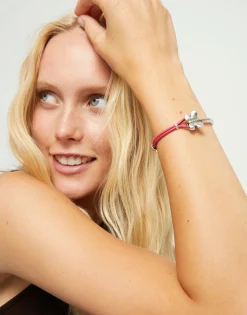 Pink leather bracelet with butterfly ornament