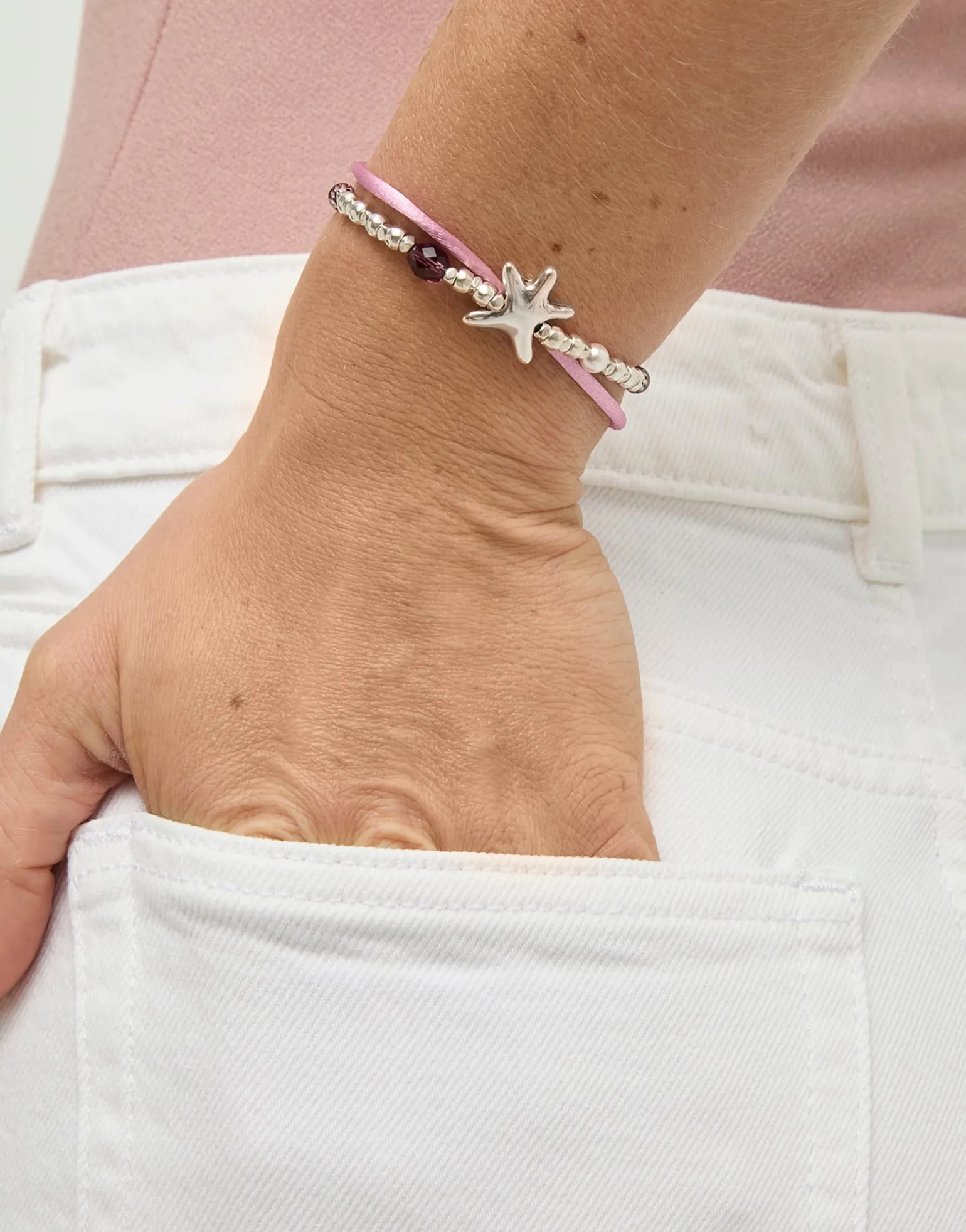 Pink silk thread and metal bracelet with starfish